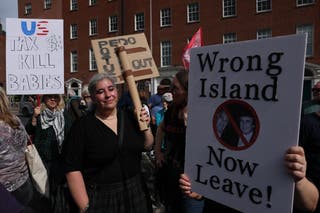 A placard showing Donald Trump with convicted paedophile Jeffrey Epstein during an anti-Trump protest march through Dublin city centre